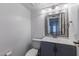 Updated bathroom with gray vanity and a large mirror at 5671 N 79Th St # 2, Scottsdale, AZ 85250