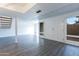 Bright living room with gray laminate floors and staircase at 5671 N 79Th St # 2, Scottsdale, AZ 85250