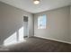 Spacious bedroom with mirrored closet doors and carpet at 5932 W Garfield St, Phoenix, AZ 85043