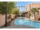 Inviting kidney-shaped pool with surrounding landscape at 6901 E Evans Dr, Scottsdale, AZ 85254