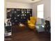 Cozy living area with comfy armchairs and built-in bookcase at 7229 S 48Th Ln, Laveen, AZ 85339