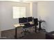 Home office with a standing desk and dual monitors at 7229 S 48Th Ln, Laveen, AZ 85339