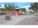 Community playground with play structures and shaded seating at 7229 S 48Th Ln, Laveen, AZ 85339
