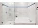 Spa-like bathroom with marble tile, walk-in shower, and soaking tub at 7272 E Gainey Ranch Rd # 75, Scottsdale, AZ 85258