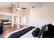 Bright bedroom with wood floors, mirrored closet doors and a ceiling fan at 7272 E Gainey Ranch Rd # 75, Scottsdale, AZ 85258