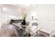 Modern dining room with glass table and view into the living room and kitchen at 7272 E Gainey Ranch Rd # 75, Scottsdale, AZ 85258