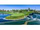 Golf course with pond and waterfall feature at 7272 E Gainey Ranch Rd # 75, Scottsdale, AZ 85258