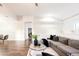 Spacious living area with hardwood floors, sectional sofa, and natural light at 7272 E Gainey Ranch Rd # 75, Scottsdale, AZ 85258