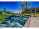 Serene waterfall feature near clubhouse at 7272 E Gainey Ranch Rd # 75, Scottsdale, AZ 85258