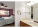 Bathroom with a vanity, mirror, and a view into the bedroom at 7436 E Chaparral Rd # 118B, Scottsdale, AZ 85250