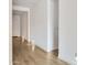 Bright hallway with wood-look floors and recessed lighting at 7612 W Jones Ave, Phoenix, AZ 85043