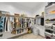 Large walk-in closet with ample shelving and hanging space at 7612 W Jones Ave, Phoenix, AZ 85043