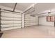 Large garage with overhead storage and epoxy flooring at 10906 E Southwind Ln, Scottsdale, AZ 85262