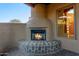 Outdoor fireplace perfect for cozy evenings at 10906 E Southwind Ln, Scottsdale, AZ 85262