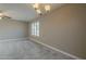 Simple dining room with light flooring and a chandelier at 13622 N 98Th Ave # R, Sun City, AZ 85351