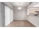 Dining area adjacent to the kitchen, with sliding glass doors at 18637 N 35Th St, Phoenix, AZ 85050