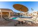 Community pool with lounge chairs, a covered area, and a hot tub at 18637 N 35Th St, Phoenix, AZ 85050