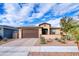 Single-story home with desert landscaping and a two-car garage at 22520 E Rosa Rd, Queen Creek, AZ 85142