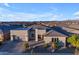 Single-story home with a two-car garage, desert landscaping, and a neutral color palette at 22678 E Stacey Rd, Queen Creek, AZ 85142