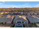 Aerial view of a house with a pool and landscaped backyard in a residential neighborhood at 22678 E Stacey Rd, Queen Creek, AZ 85142