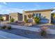 Modern home with a neutral color scheme, two-car garage, and desert landscaping at 22678 E Stacey Rd, Queen Creek, AZ 85142