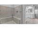 Large shower with glass doors and a built-in seat at 22678 E Stacey Rd, Queen Creek, AZ 85142