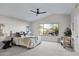 Bright bedroom with carpeted floor and large window at 3236 E San Angelo Ave, Gilbert, AZ 85234