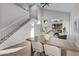 Light-filled dining area with a view to the entryway at 3236 E San Angelo Ave, Gilbert, AZ 85234