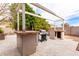 Outdoor kitchen area with built-in BBQ and pergola at 3470 E Wildhorse Dr, Gilbert, AZ 85297