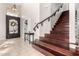 Elegant staircase with dark wood and wrought iron railings at 3470 E Wildhorse Dr, Gilbert, AZ 85297