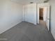 Bedroom with double door closet and access to bathroom at 4009 W Desert Dr, Laveen, AZ 85339