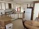 Galley kitchen with wood cabinets and appliances at 4065 E University Dr # 568, Mesa, AZ 85205