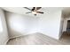 Bright bedroom with wood-look flooring and ceiling fan at 40673 N Glen Meadows Ln, San Tan Valley, AZ 85140