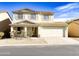 Two-story house with a two-car garage and desert landscaping at 40673 N Glen Meadows Ln, San Tan Valley, AZ 85140