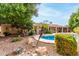 Private backyard retreat with a pool, mature trees, and desert landscaping at 418 W Bentrup St, Chandler, AZ 85225