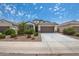 Single story home with attached garage and landscaped front yard at 4725 W Orange Ave, Coolidge, AZ 85128