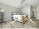 Spacious bedroom with wood-look tile floors, ceiling fan and built-in closet at 5016 E Marconi Ave, Scottsdale, AZ 85254