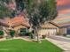Charming single-story home with landscaped lawn and two-car garage at 5016 E Marconi Ave, Scottsdale, AZ 85254