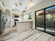 Kitchen with island and sliding door to backyard access at 5016 E Marconi Ave, Scottsdale, AZ 85254