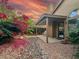 Charming backyard patio area with stone and flowering plants at 5016 E Marconi Ave, Scottsdale, AZ 85254