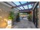 Inviting patio with pergola, lush plants, and pool view at 5347 N La Plaza Cir, Phoenix, AZ 85012