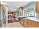 Modern kitchen features stainless steel sink and opens to dining area at 5444 E Kings Ave, Scottsdale, AZ 85254