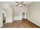 Spacious bedroom with wood-look floors and access to hallway at 6015 W Kings Ave, Glendale, AZ 85306