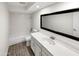 Updated bathroom with white vanity and tile flooring at 610 W Medina Ave, Mesa, AZ 85210