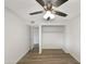 Bright bedroom with hardwood floors and a large closet at 610 W Medina Ave, Mesa, AZ 85210