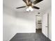 Spacious bedroom with ceiling fan and grey carpet at 610 W Medina Ave, Mesa, AZ 85210