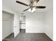 Bedroom with ceiling fan and access to the kitchen at 610 W Medina Ave, Mesa, AZ 85210