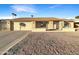 Ranch style home with a two-car garage and landscaped front yard at 610 W Medina Ave, Mesa, AZ 85210