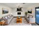 Bright living room featuring a fireplace and wood-look floors at 610 W Medina Ave, Mesa, AZ 85210