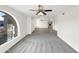 Bright living room with hardwood floors and a view into the kitchen at 610 W Medina Ave, Mesa, AZ 85210